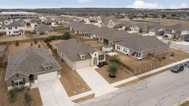 birds eye view of property with a residential view