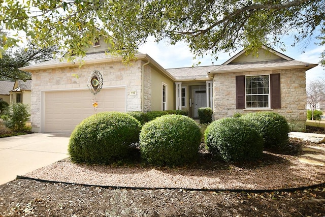 ranch-style house featuring driveway and an attached garage