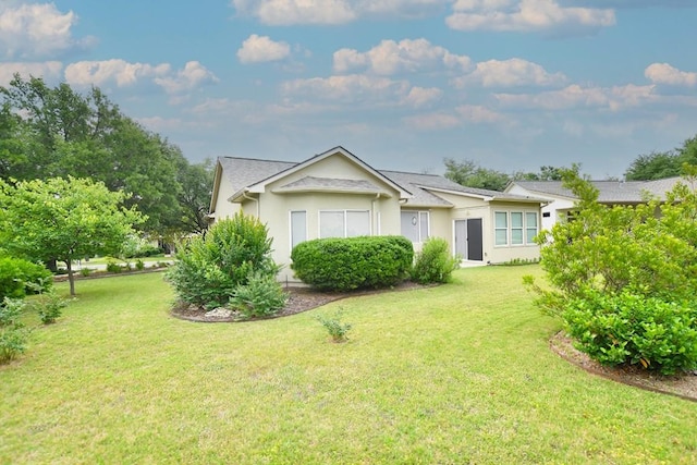 116 Dandelion Dr, Georgetown, TX 78633 - single story home featuring a front lawn and stucco siding
