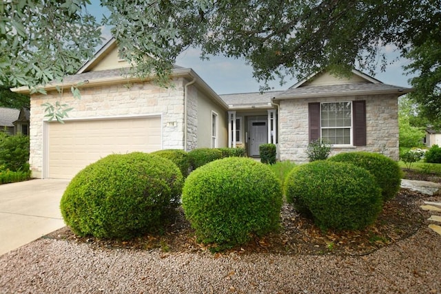 116 Dandelion Dr, Georgetown, TX 78633 - ranch-style home featuring stone siding, a garage, and concrete driveway