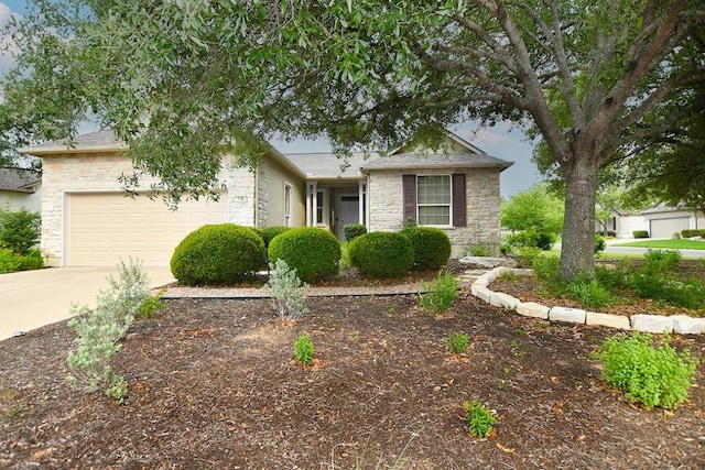 116 Dandelion Dr, Georgetown, TX 78633 - view of front facade featuring stone siding, a garage, and driveway