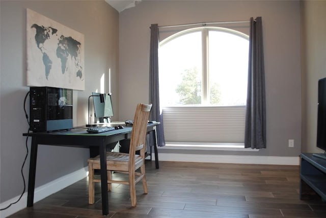 home office featuring baseboards and wood finished floors