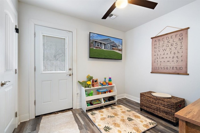 entryway with visible vents, baseboards, ceiling fan, and wood finished floors