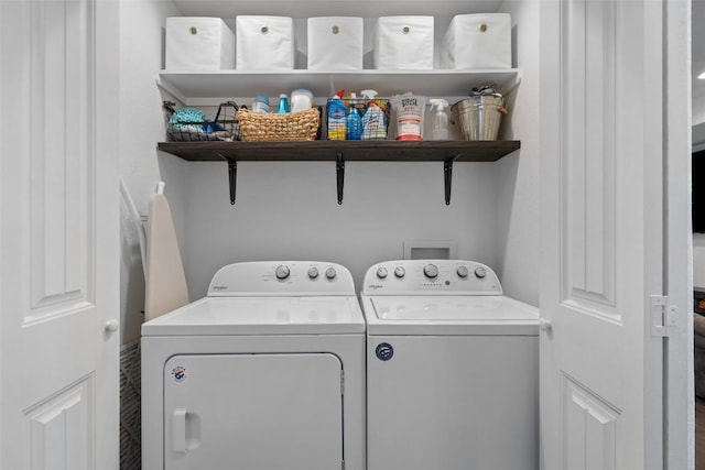 clothes washing area featuring laundry area and washing machine and clothes dryer