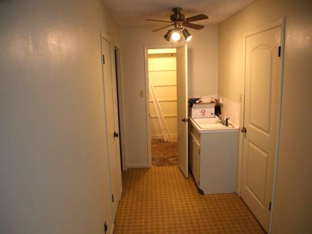 laundry area with laundry area and a ceiling fan