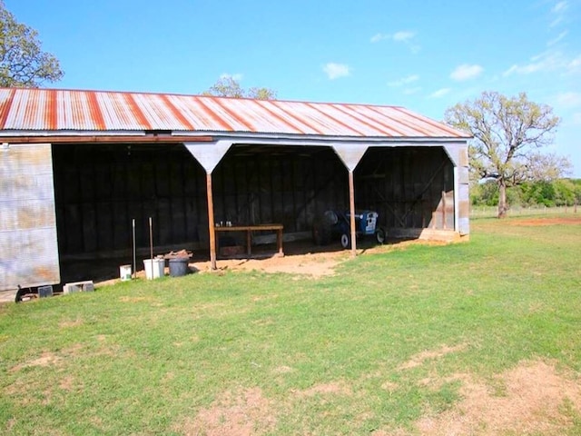 view of pole building with a yard