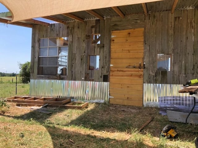 exterior space featuring wooden walls