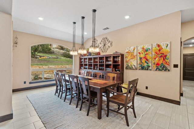 dining room featuring arched walkways, visible vents, recessed lighting, and baseboards