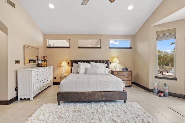 bedroom with visible vents, lofted ceiling, and baseboards