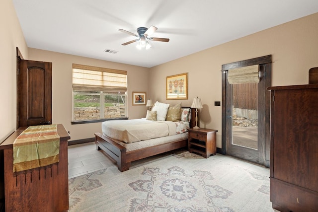 bedroom with visible vents, access to exterior, light tile patterned flooring, baseboards, and ceiling fan