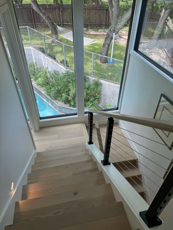 stairway with wood finished floors