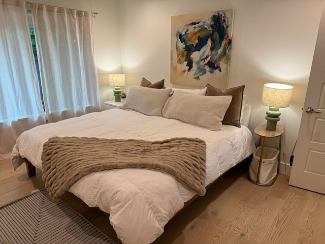 bedroom featuring wood finished floors