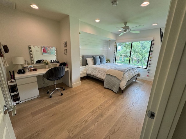 bedroom with recessed lighting, baseboards, and light wood-style floors