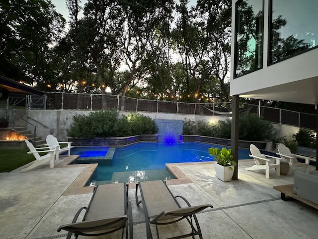 view of swimming pool with a patio, a fenced backyard, and a fenced in pool