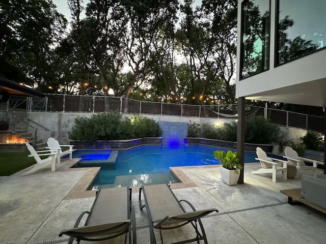 212 Westhaven Dr, West Lake Hills, TX 78746 - view of pool featuring a patio area, a fenced backyard, a pool with connected hot tub, and an outdoor fire pit