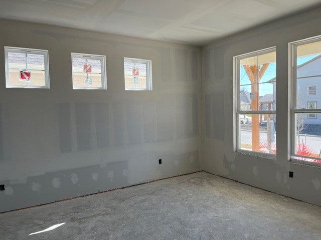 empty room featuring plenty of natural light