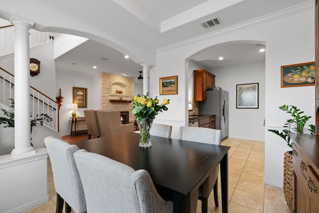 14100 Avery Ranch Blvd Unit 1402, Austin, TX 78717 - dining area featuring arched walkways, ornate columns, stairs, crown molding, and light tile patterned floors
