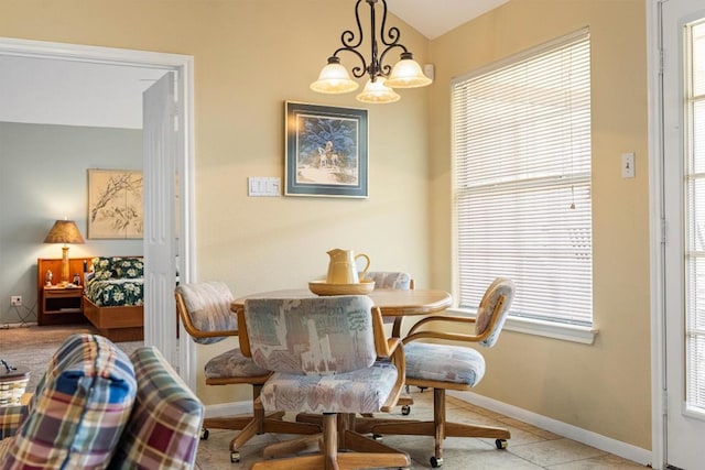 20531 Highland Lake Dr, Lago Vista, TX 78645 - dining room featuring a chandelier, tile patterned flooring, and vaulted ceiling