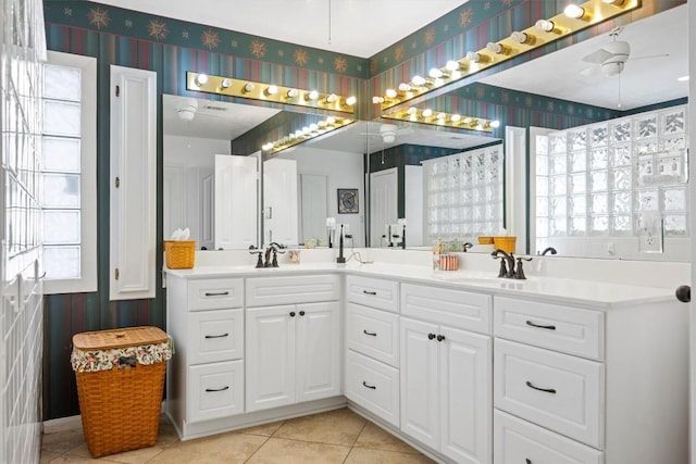 20531 Highland Lake Dr, Lago Vista, TX 78645 - bathroom featuring wallpapered walls, double vanity, tile patterned floors, and ceiling fan