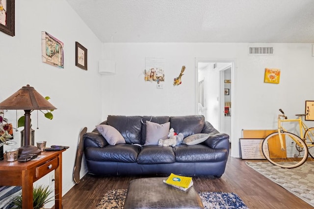 2803 Hemphill Park Unit B310, Austin, TX 78705 - living room with wood finished floors, visible vents, and a textured ceiling