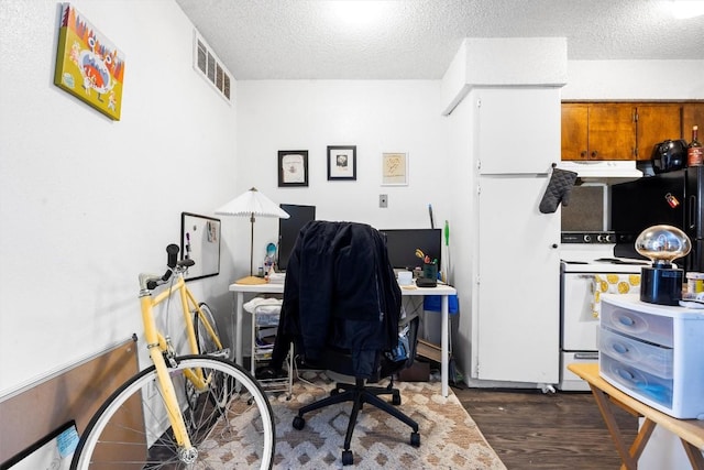 2803 Hemphill Park Unit B310, Austin, TX 78705 - office area with dark wood finished floors, a textured ceiling, and visible vents