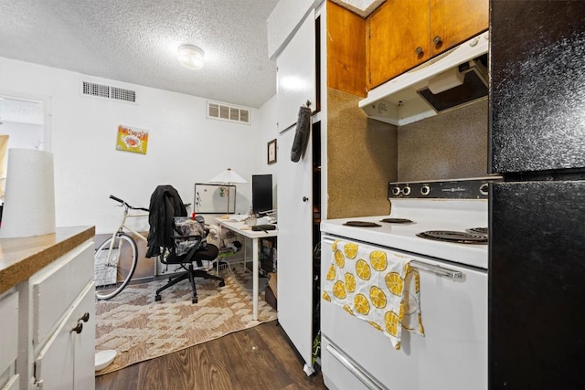 2803 Hemphill Park Unit B310, Austin, TX 78705 - office area featuring dark wood-type flooring and a textured ceiling