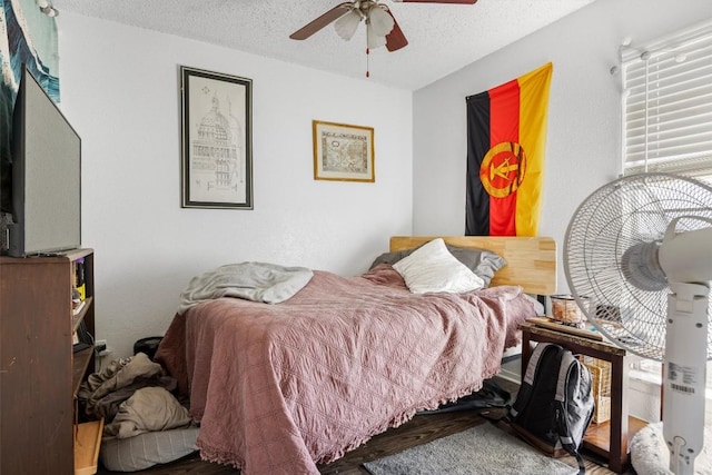 2803 Hemphill Park Unit B310, Austin, TX 78705 - bedroom with a textured ceiling and ceiling fan