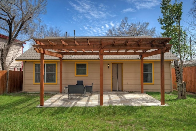 back of property with a patio, a pergola, a yard, and fence