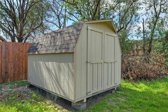 view of shed with a fenced backyard