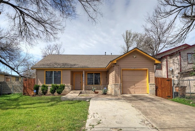 view of front of home featuring fence, an attached garage, a shingled roof, a front lawn, and concrete driveway