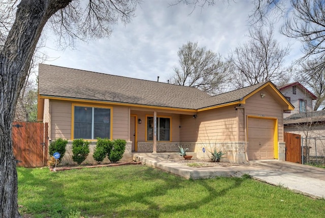 single story home with fence, driveway, roof with shingles, an attached garage, and a front lawn