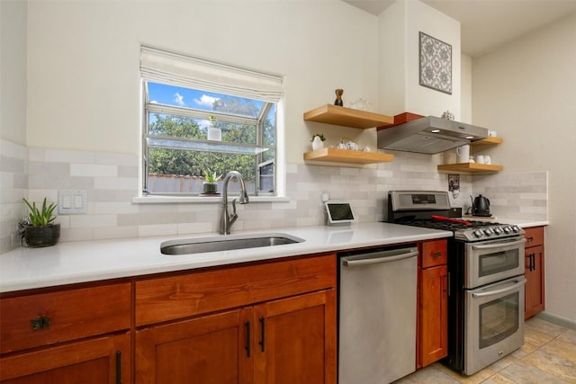 kitchen with a sink, open shelves, under cabinet range hood, stainless steel appliances, and light countertops