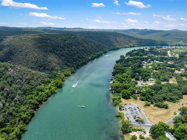 aerial view with a view of trees and a water and mountain view