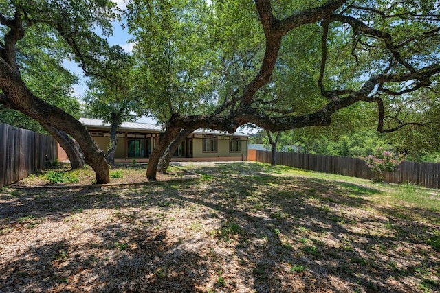 view of yard with a fenced backyard