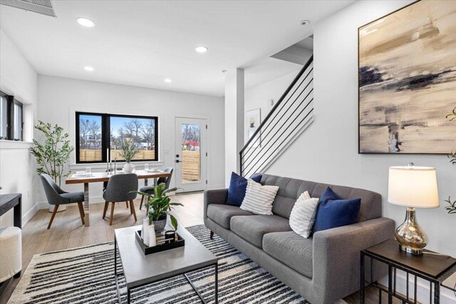204 Pecan Dr Unit 2, Austin, TX 78753 - living area with wood finished floors, recessed lighting, and stairs