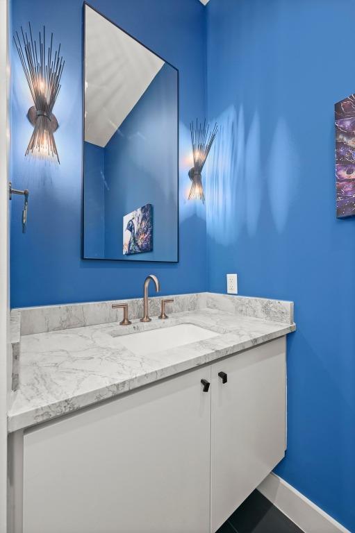 bathroom featuring vanity and baseboards