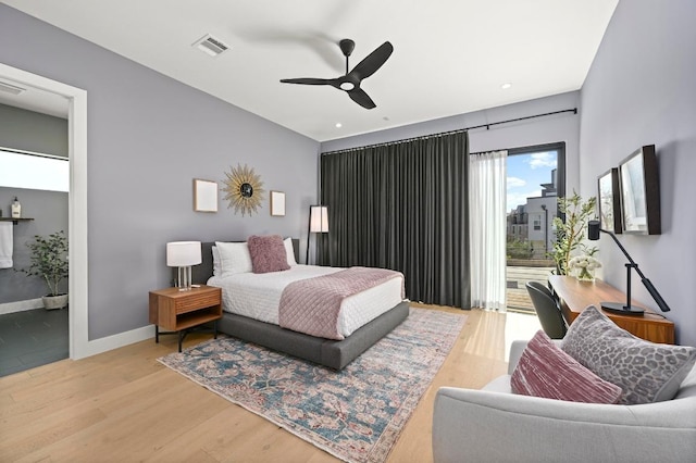 bedroom with access to exterior, visible vents, ceiling fan, baseboards, and light wood-type flooring