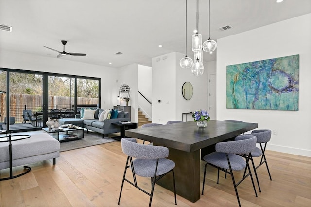 dining space with visible vents, baseboards, stairs, recessed lighting, and light wood-style floors