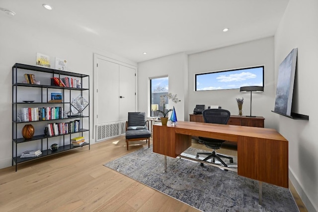 home office featuring recessed lighting, visible vents, baseboards, and wood finished floors