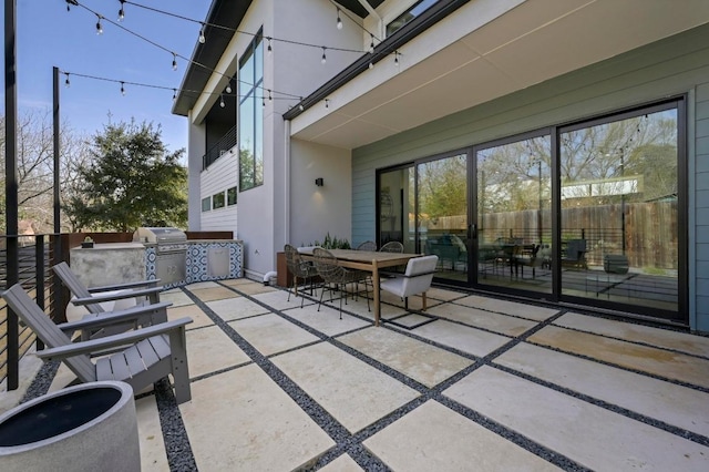 view of patio / terrace featuring outdoor dining space and fence