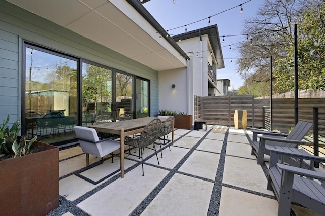 view of patio / terrace featuring outdoor dining space and fence