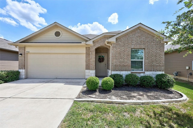 single story home featuring brick siding, driveway, and a garage