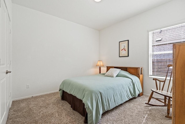 carpeted bedroom with baseboards