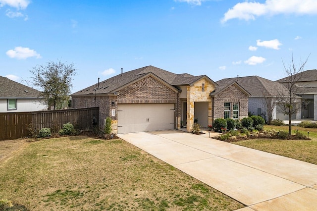 701 Mallow Rd, Leander, TX 78641 - view of front of house with a garage, driveway, brick siding, and stone siding