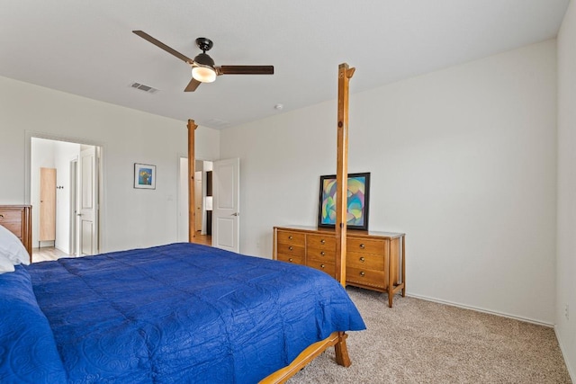 bedroom with a ceiling fan, visible vents, and light carpet