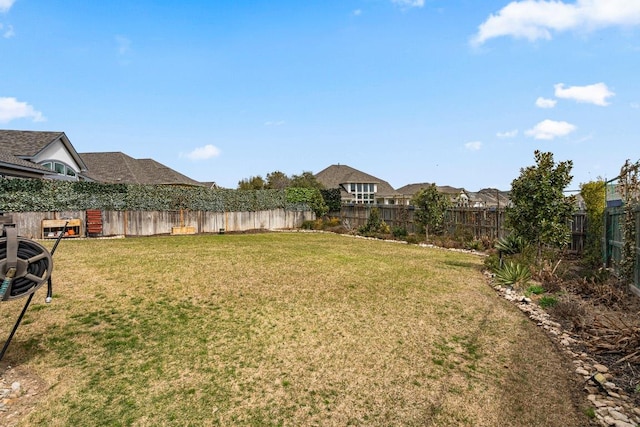 view of yard with a fenced backyard