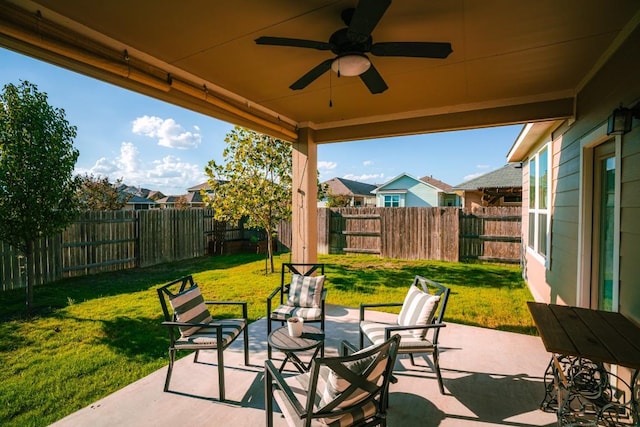 view of patio featuring a ceiling fan and a fenced backyard