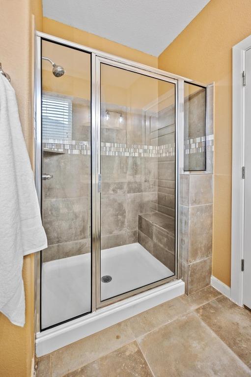 full bathroom with a shower stall