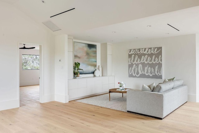 living area with visible vents and light wood-style flooring