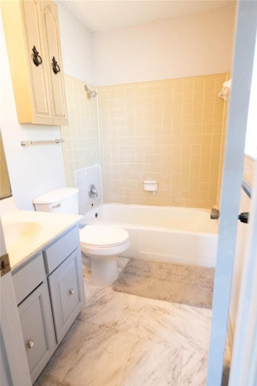 bathroom featuring shower / bathing tub combination, toilet, and vanity